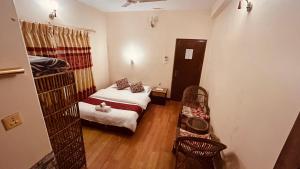 Voodi või voodid majutusasutuse Cherry Garden Pokhara toas