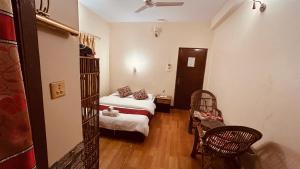 Voodi või voodid majutusasutuse Cherry Garden Pokhara toas