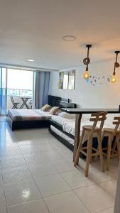 a bedroom with a bed and a table in it at Hospedaje,Cartagena,Clasicos,Turismocolombia-fit in Cartagena de Indias