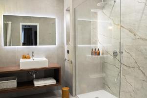 a bathroom with a shower and a sink at Le Dimore del Centro in Bari