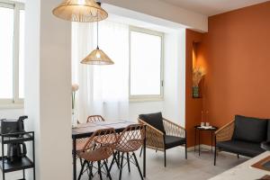 a dining room with a table and chairs at Le Dimore del Centro in Bari +33 photos