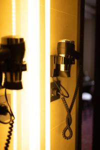a pair of phones hanging on a door at The Fifth Floor by Old Town Hotel in Timişoara