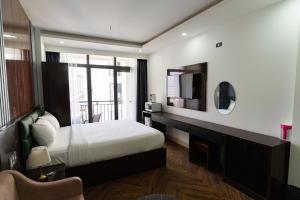 Ένα ή περισσότερα κρεβάτια σε δωμάτιο στο Mama Hotel And Apartment - Free Sauna And Gym +99 φωτογραφίες
