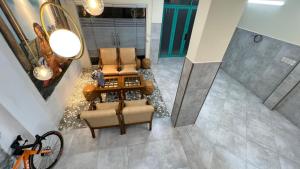 an overhead view of a living room with two chairs and a table at C Chau Apartment in Ho Chi Minh City