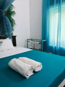 Postel nebo postele na pokoji v ubytování Casa Del Ceylon
