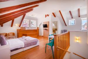 En eller flere senge i et værelse på Apartments Feri