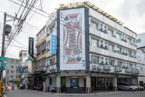 a building with a large sign on the side of it at 日日藍旅市區民宿 in Hualien City