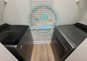 a kitchen with a stove and a sink with a window at 2Br 2Ba Condo on Golf Course in Pawleys Island +39 photos