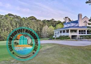 a large house with a sign in front of it at 2Br 2Ba Condo on Golf Course in Pawleys Island