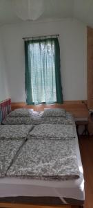 Posteľ alebo postele v izbe v ubytovaní Igricz Farmház