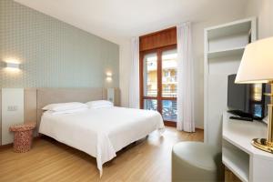 Кровать или кровати в номере Hotel Croce Di Malta