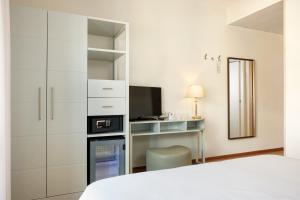 Кровать или кровати в номере Hotel Croce Di Malta