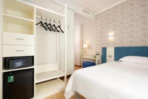 Кровать или кровати в номере Hotel Croce Di Malta