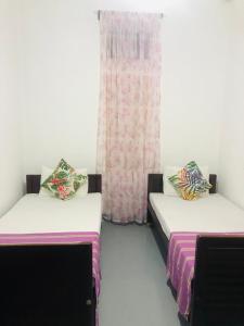 Postel nebo postele na pokoji v ubytování Casa Del Ceylon