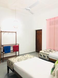 Postel nebo postele na pokoji v ubytování Casa Del Ceylon