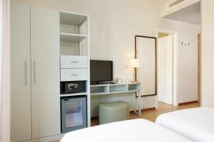 Кровать или кровати в номере Hotel Croce Di Malta