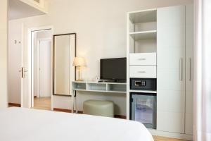 Телевизор и/или развлекательный центр в Hotel Croce Di Malta