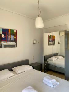 Posteľ alebo postele v izbe v ubytovaní Art Suites Athens