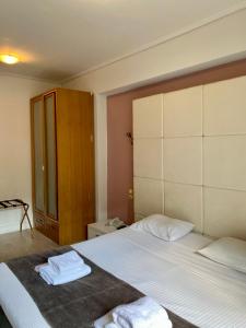 Posteľ alebo postele v izbe v ubytovaní Art Suites Athens