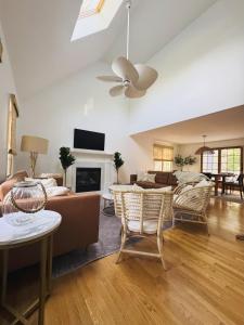 a living room with a couch and a table at Orleans Holiday House in Orleans