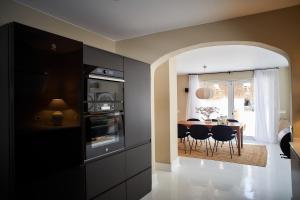 A kitchen or kitchenette at UNIQUE Homes Lajares - Only Adults