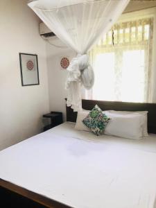 Postel nebo postele na pokoji v ubytování Casa Del Ceylon