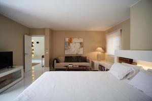 A bed or beds in a room at UNIQUE Homes Lajares - Only Adults