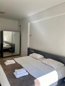 Posteľ alebo postele v izbe v ubytovaní Art Suites Athens