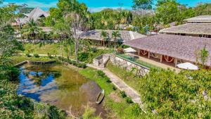 an aerial view of a resort with a pond at Hotel Villa Mercedes Palenque in Palenque