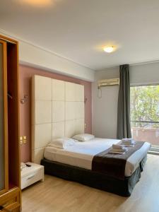 Posteľ alebo postele v izbe v ubytovaní Art Suites Athens