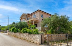 a house with a fence in front of a road at Gorgeous Apartment In Razanj With Wifi in Ražanj