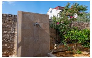 a bathroom with a shower in a stone wall at Gorgeous Apartment In Razanj With Wifi in Ražanj +11 photos