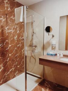 a bathroom with a shower and a sink at Doade in Hio