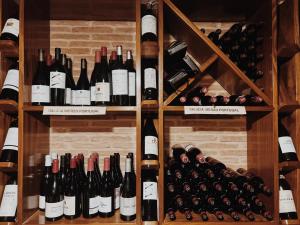 a bunch of wine bottles in a wine cellar at Doade in Hio