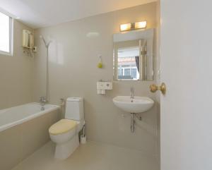 a white bathroom with a toilet and a sink at UrbanLoft Sukhumvit 5BR Bangkok 5 min BKK Hospital in Ban Sam Ngam +60 photos