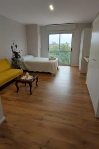 En eller flere senge i et værelse på Yo Salta