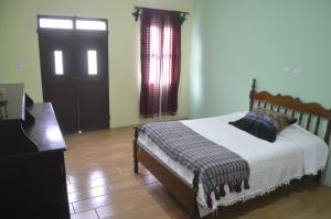 Ένα ή περισσότερα κρεβάτια σε δωμάτιο στο Casa Tuta