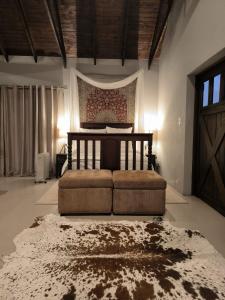 a bedroom with a bed in the middle of a room at Vaal River Royal Mafube Luxury Tented Lodge in Vosburg