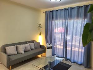 a living room with a couch and a window at Alojamiento Vista Hermosa in Ayamonte