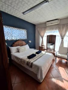 Ένα ή περισσότερα κρεβάτια σε δωμάτιο στο The Loft