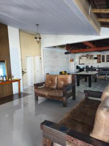 Posezení v ubytování Casa com piscina matinhos + 7 fotografií