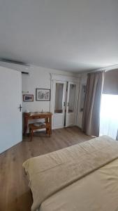 a bedroom with a bed and a table in it at Cukarin Heritage in Korčula +7 photos