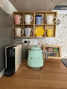 a kitchen with a tea kettle next to a microwave at Cukarin Heritage in Korčula