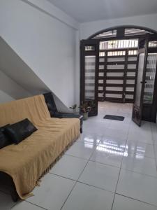 Posezení v ubytování Quarto Confortável no Centro