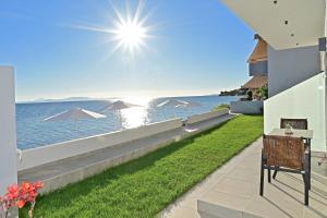 a view of the ocean from the balcony of a house at Vista Paraiso Inn in Nea Potidaea