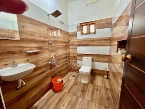 a bathroom with a sink and a toilet at Cliffnest by Nivara 4BHK Luxury Villa in Varkala in Varkala +48 photos