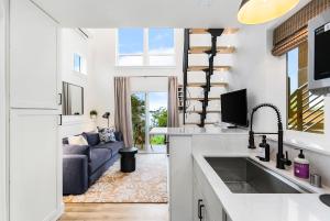 a kitchen with a sink and a living room with a couch at Covelet Hideaway in Blaine