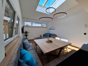a living room with a couch and a table at Das Freigeist in Flachau