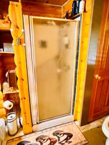 a glass door of a refrigerator in a kitchen at The Gratitude Homestay in Alamosa +36 photos