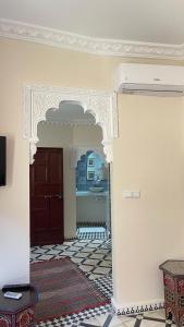 a room with a door and a tile floor at mehek in Asilah